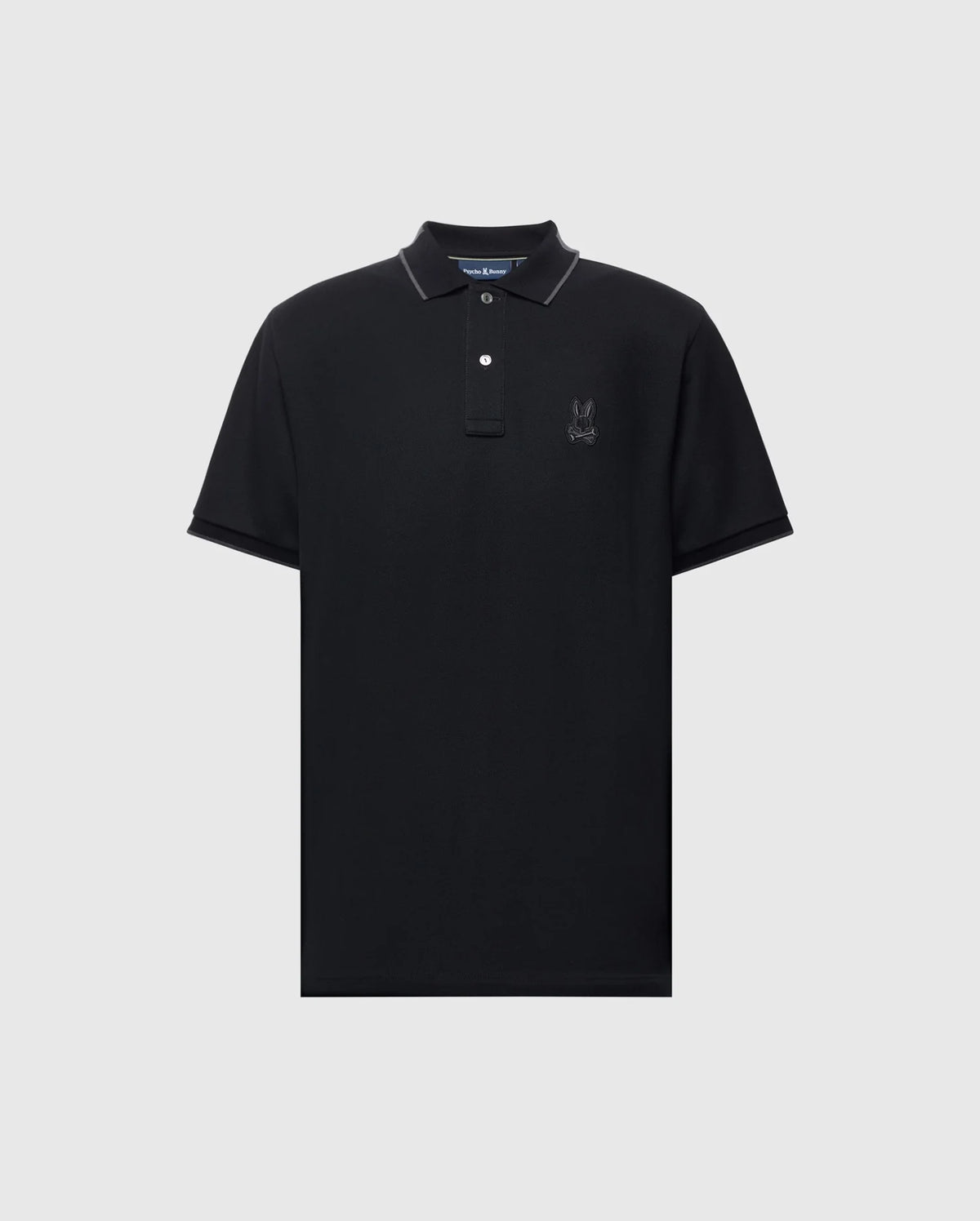 The Psycho Bunny MENS NEW CASTLE PIQUE POLO B6K487F200 is a black, slim-fit polo shirt with short sleeves and a collar. It's crafted from luxurious Pima cotton for comfort and showcases a subtle embroidered logo on the left chest, complemented by two white buttons on the placket.