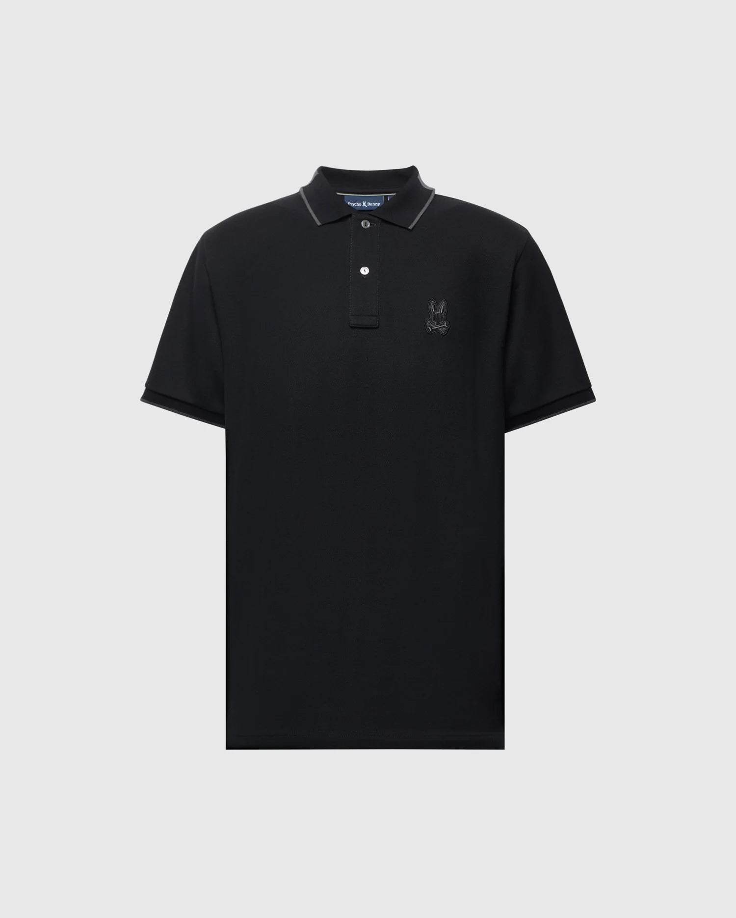 The Psycho Bunny MENS NEW CASTLE PIQUE POLO B6K487F200 is a black, slim-fit polo shirt with short sleeves and a collar. It's crafted from luxurious Pima cotton for comfort and showcases a subtle embroidered logo on the left chest, complemented by two white buttons on the placket.