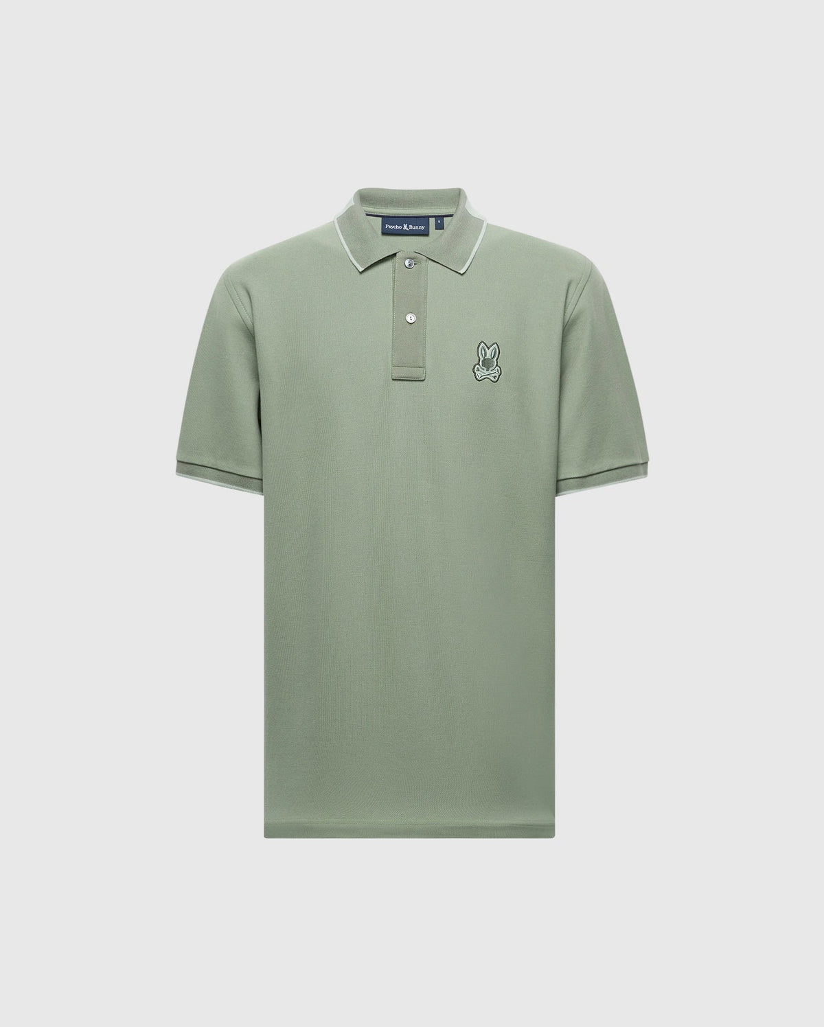 The MENS NEW CASTLE PIQUE POLO - B6K487F200 from Psycho Bunny is a green Pima cotton polo with short sleeves, contrast detailing, white-edged collar, and two buttons. This slim-fit shirt features a small embroidered rabbit logo on the left chest area.