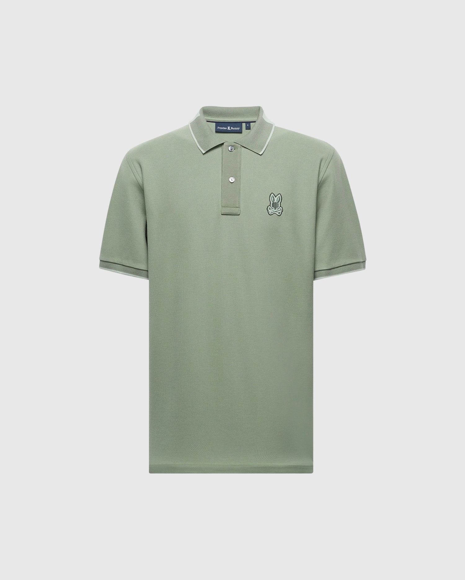 The MENS NEW CASTLE PIQUE POLO - B6K487F200 from Psycho Bunny is a green Pima cotton polo with short sleeves, contrast detailing, white-edged collar, and two buttons. This slim-fit shirt features a small embroidered rabbit logo on the left chest area.