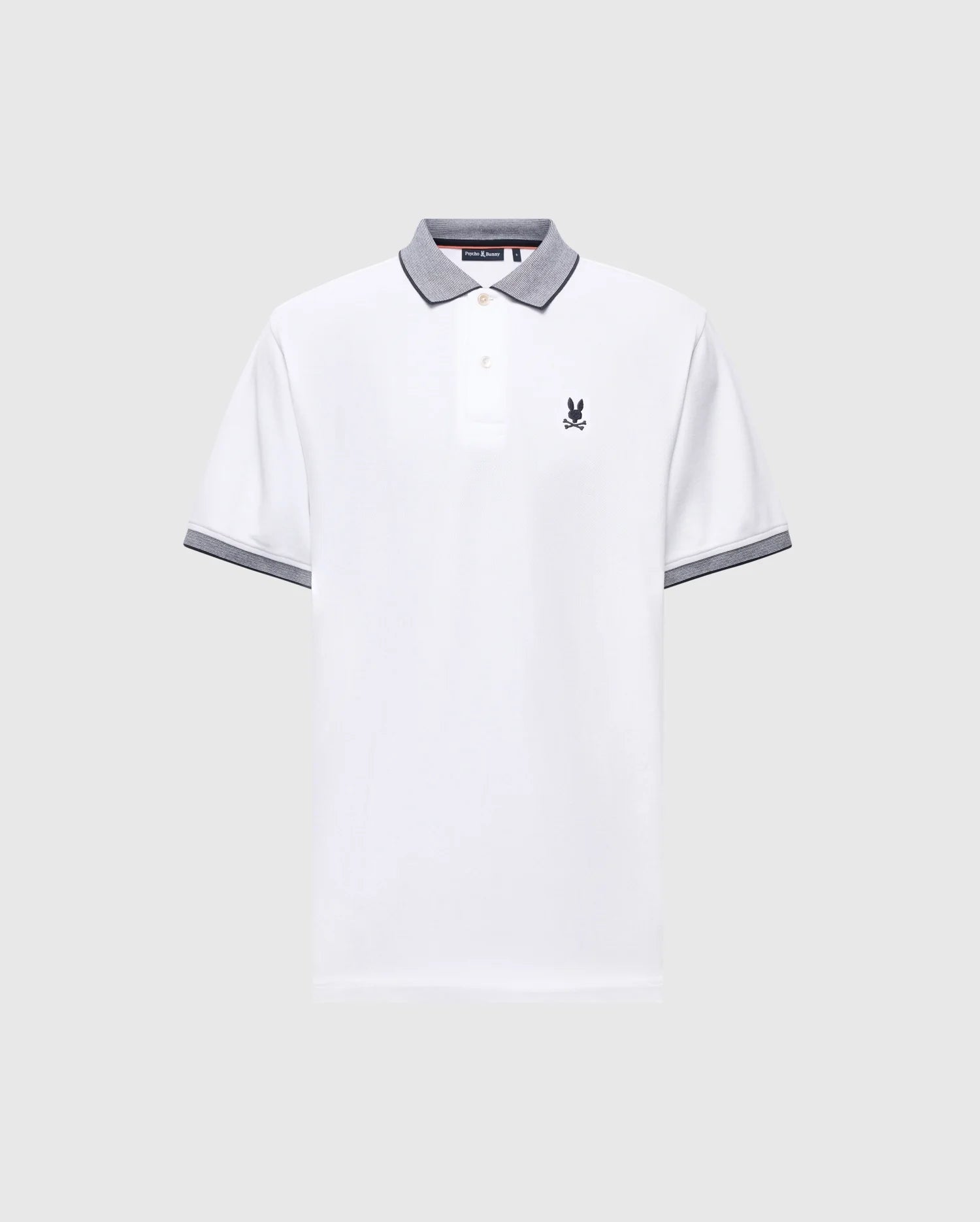 The MENS JONAS STRIPE COLLAR PIQUE POLO by Psycho Bunny features a white Pima cotton fabric with a gray collar and sleeves, three buttons, and a small embroidered bunny logo on the left chest, enhancing its subtle elegance.