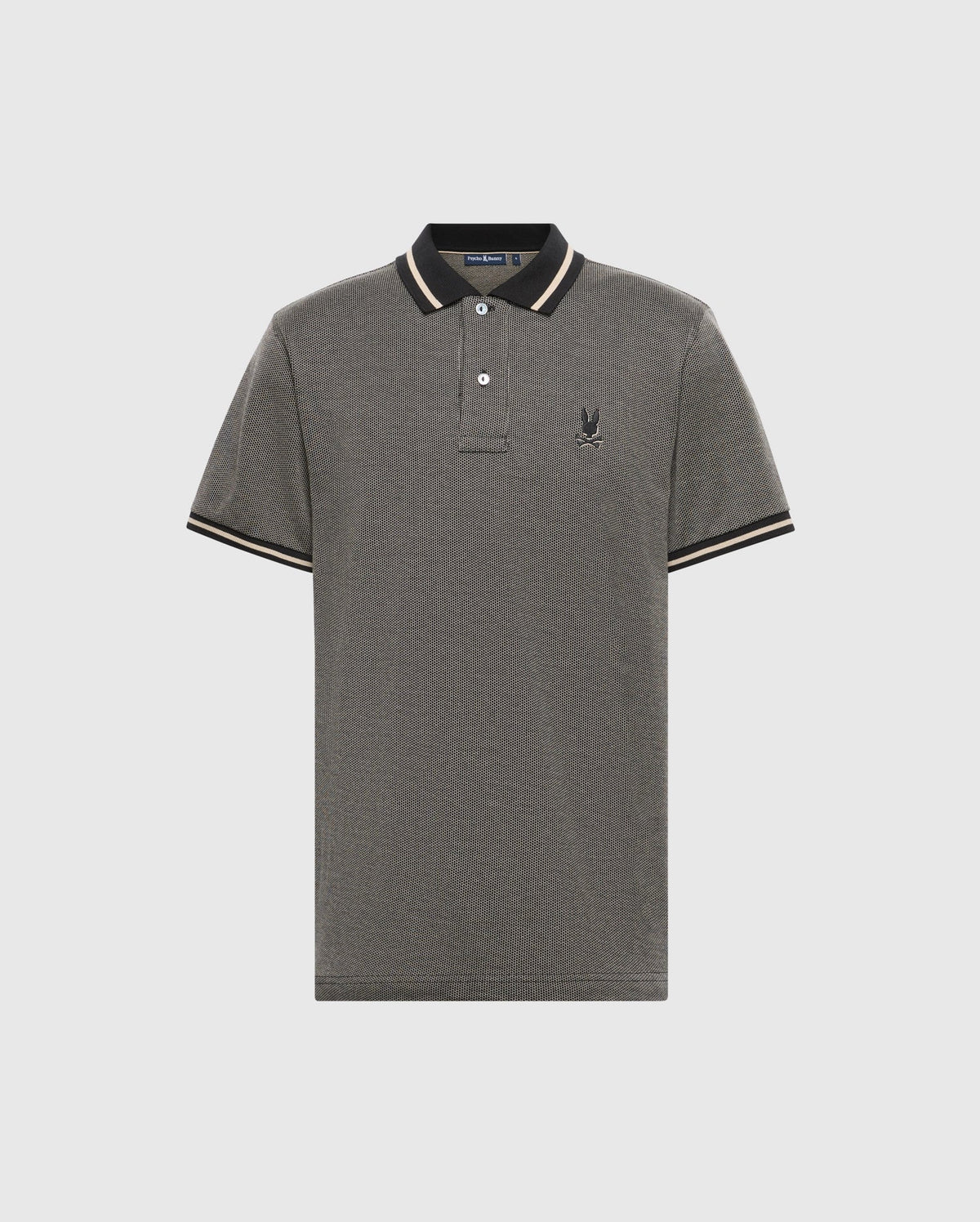 The Men's Warsaw Jacquard Pique Polo - B6K901E200 by Psycho Bunny features a sophisticated gray shade complemented by black and beige accents on the collar and sleeves, along with a subtle emblem on the left chest. Made from exquisite Peruvian Pima cotton, this jacquard-knit polo is set against an off-white background, embodying a sense of refined elegance.