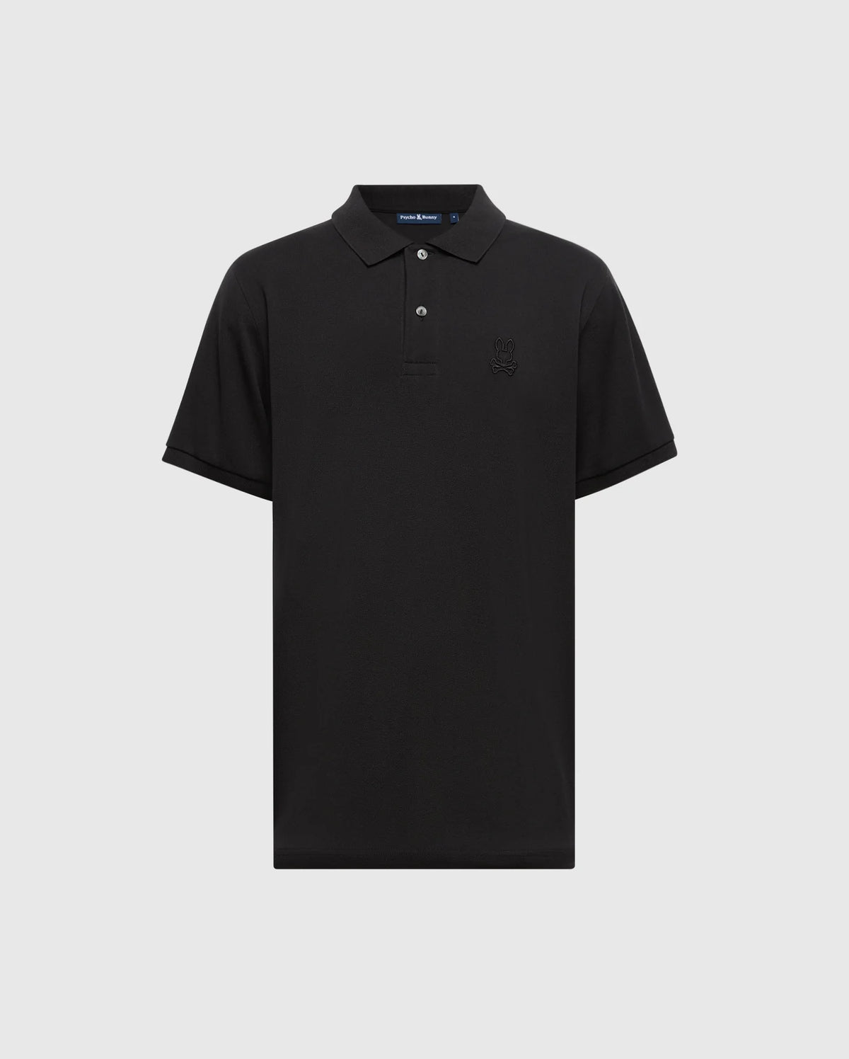 The Psycho Bunny MENS JAMES PREMIUM PIQUE POLO SHIRT - B6K945D200 is a black polo with short sleeves, a collar, and crafted from durable Pima cotton. It features a subtle embroidered logo on the left chest and includes a front buttoned placket for a classic look.