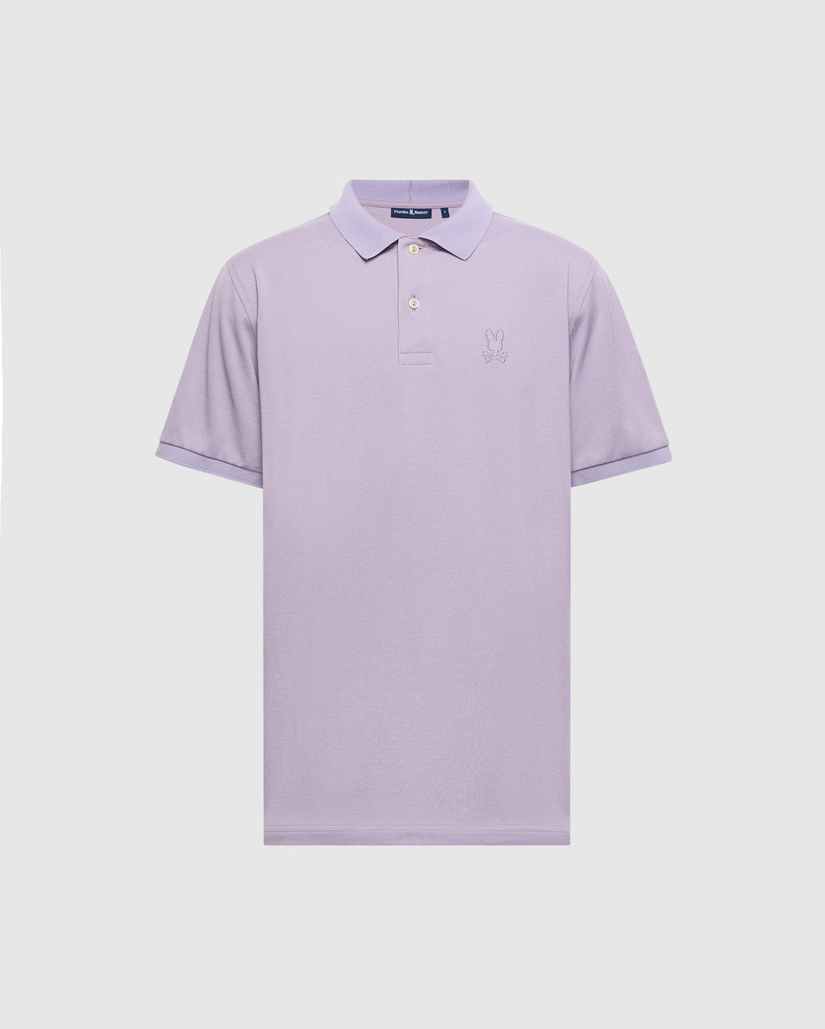 Experience style and comfort with the Psycho Bunny MENS JAMES PIQUE POLO. Crafted from durable Pima cotton in lavender, it features a slim fit, short sleeves, a two-button collar, and an embroidered bunny logo on the left chest.