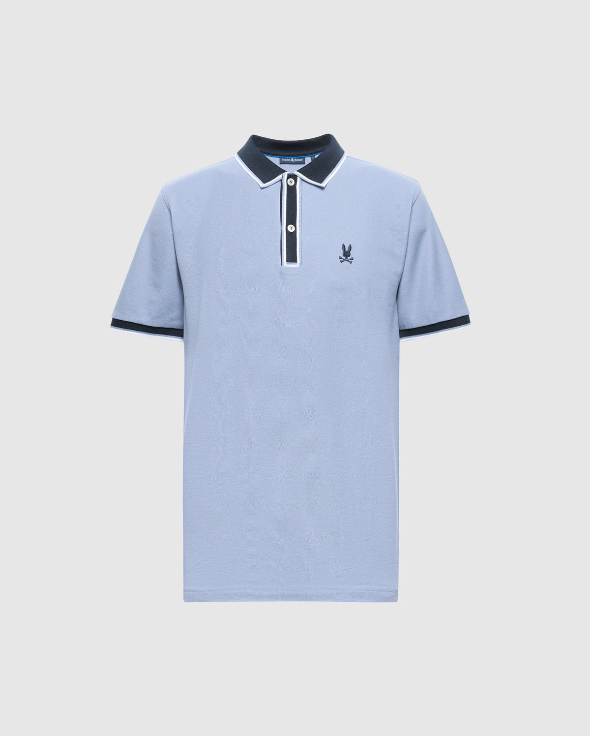 The Psycho Bunny MENS KENT PIQUE POLO - B6K951D200 is a premium men's polo shirt in light blue, featuring a navy collar and cuffs, a white button placket, and an embroidered logo on the left chest. Crafted from fine materials, it showcases delicate white trim on the collar and sleeves for added elegance.