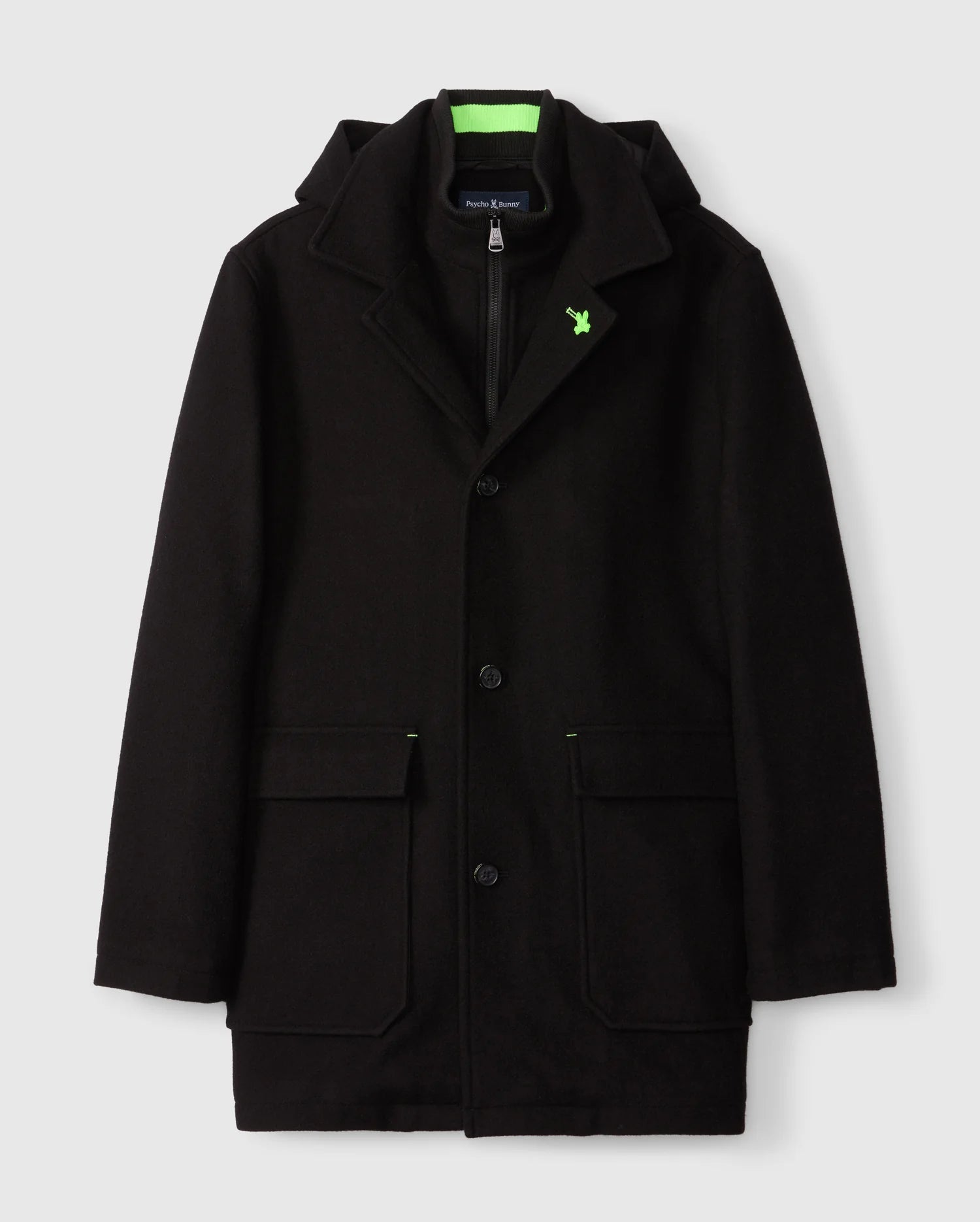 The Psycho Bunny MENS STAFFORD WOOL BLEND COAT - B6N551D200 is an elegant black coat with a high collar, zippered inner lining, green embroidered chest logo, buttoned front, and two large front pockets. Photographed against a plain white background.