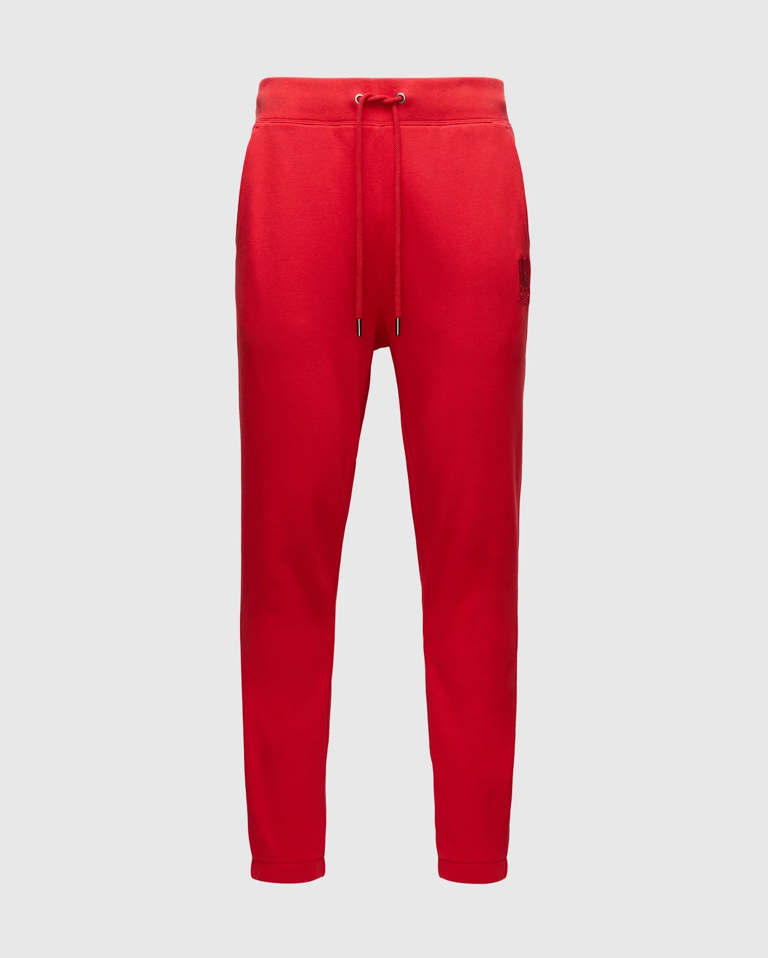 The Psycho Bunny MENS PIERCE ESSENTIAL FRENCH TERRY SWEATPANT - B6P136E200 is a red lounge pant featuring an elastic waistband with drawstring, two side pockets, and tapered legs, crafted from cotton French terry.