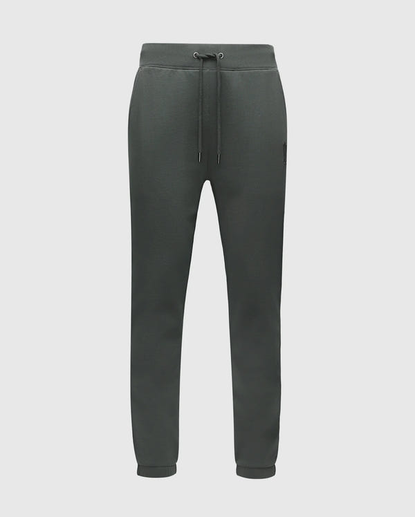 The Psycho Bunny Men's Pierce Essential French Terry Sweatpants (B6P136E200) in dark green are made from cotton French terry and feature a drawstring waist, side pockets, and cuffed ankles, showcased against a plain background.