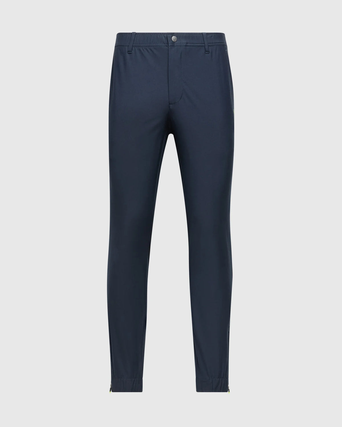 Psycho Bunny's MENS MADISON COMMUTER PANT - B6P395Z1WB features a slim fit, navy blue design with an elastic waistband, front pockets, and button closure. Made from stretch woven material for comfort, they are displayed against a light gray background.