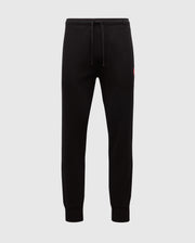 The MENS VAIL WAFFLE LOUNGE PANT - B6P673E200 by Psycho Bunny are black joggers made from a Pima Cotton Blend. They feature elastic cuffs and a drawstring waistband against a plain background, with a small red logo on the hip that underscores their comfort for lounging on relaxed days.