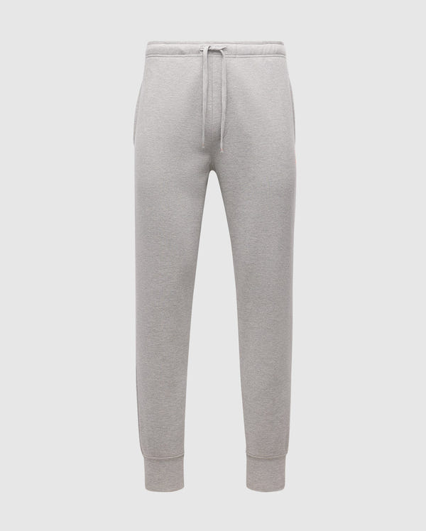 The MENS VAL WAFFLE LOUNGE PANT by Psycho Bunny, SKU B6P673E200, are showcased against a plain white background. These gray pants for men come with a drawstring waistband and elastic cuffs, made from soft pima cotton that offers a relaxed fit, perfect for casual or athletic wear.