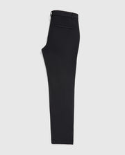 A single black trouser leg crafted from stretch cotton-nylon textile, with a visible waistband and side tab detail, displayed against a plain white background. This is the MENS GABLE REGULAR FIT SPORT PANT by Psycho Bunny.