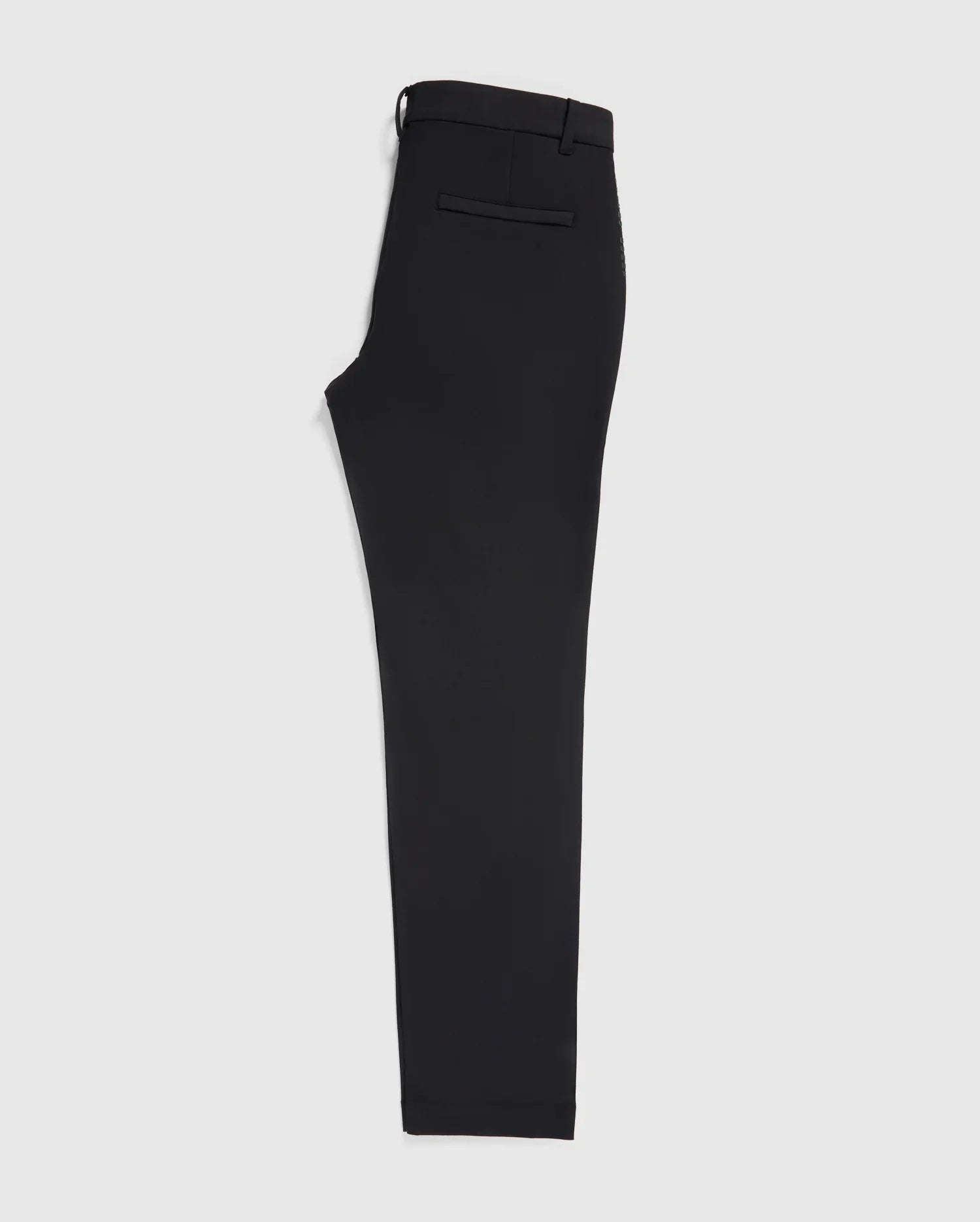 A single black trouser leg crafted from stretch cotton-nylon textile, with a visible waistband and side tab detail, displayed against a plain white background. This is the MENS GABLE REGULAR FIT SPORT PANT by Psycho Bunny.