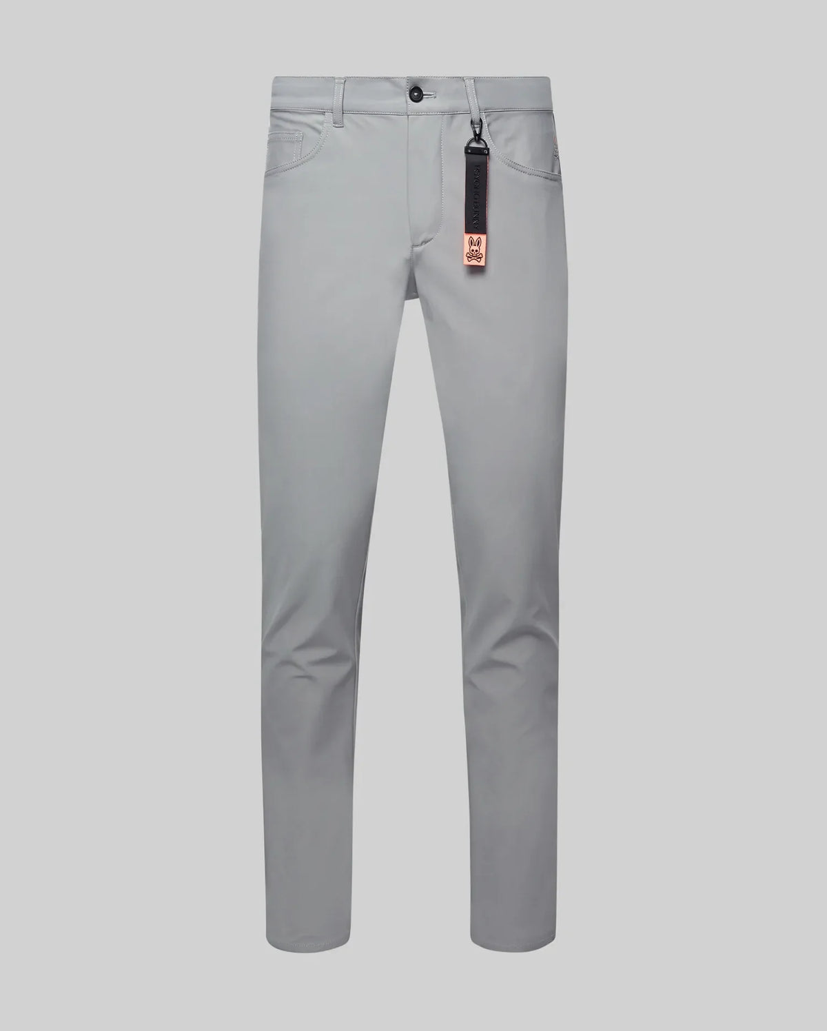 Mens Maverick 10k Step Pant in light grey, featuring a slim fit, smooth performance fabric, black button, coin pocket, and a black/orange Psycho Bunny logo keychain.