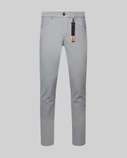 Mens Maverick 10k Step Pant in light grey, featuring a slim fit, smooth performance fabric, black button, coin pocket, and a black/orange Psycho Bunny logo keychain.