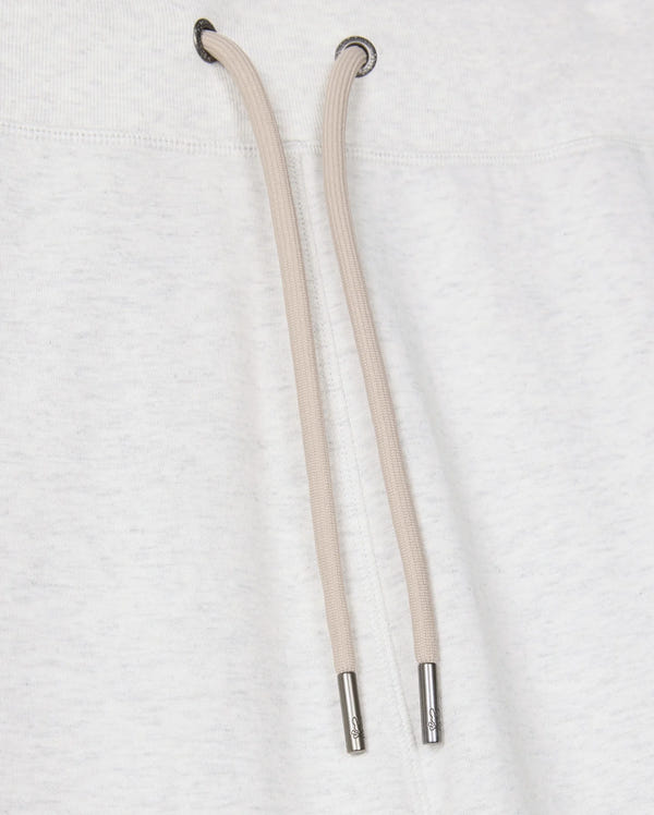 Close-up of a light gray cotton-blend drawstring hoodie featuring two tan drawstrings with metal tips against the fabric. The drawstrings descend from metal eyelets at the neck area, beautifully pairing with Psycho Bunny's MENS JAMES PREMIUM SWEATPANT - B6P791D200 for a stylish and comfortable ensemble.