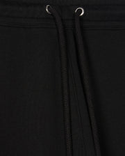 Close-up view of the black Psycho Bunny MENS PACIFIC CHENILLE JOGGER - B6P972D200, highlighting a drawstring with metal eyelets. The fabric texture is clearly visible, accentuating the casual design of these stylish bottoms.