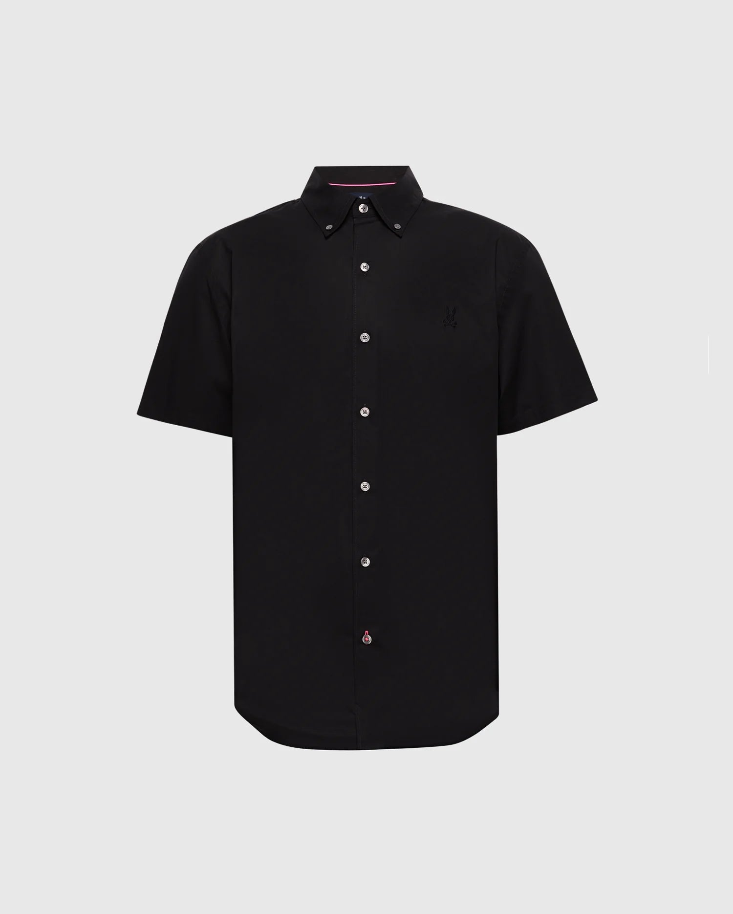 The Psycho Bunny MENS GABRIEL SHORT SLEEVE SHIRT (B6Q351F200) is a black woven stretch button-up with white buttons, an embroidered logo on the left chest, pink detailing on the inner collar, and a slightly curved classic hem for timeless style.