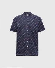 The Psycho Bunny MENS RENMARK STRETCH POPLIN WOVEN SHIRT - B6Q629F200 is a short-sleeved, dark blue shirt with diagonal stripes and small, colorful text. Featuring a button-down front and classic collar, it combines style and comfort seamlessly.