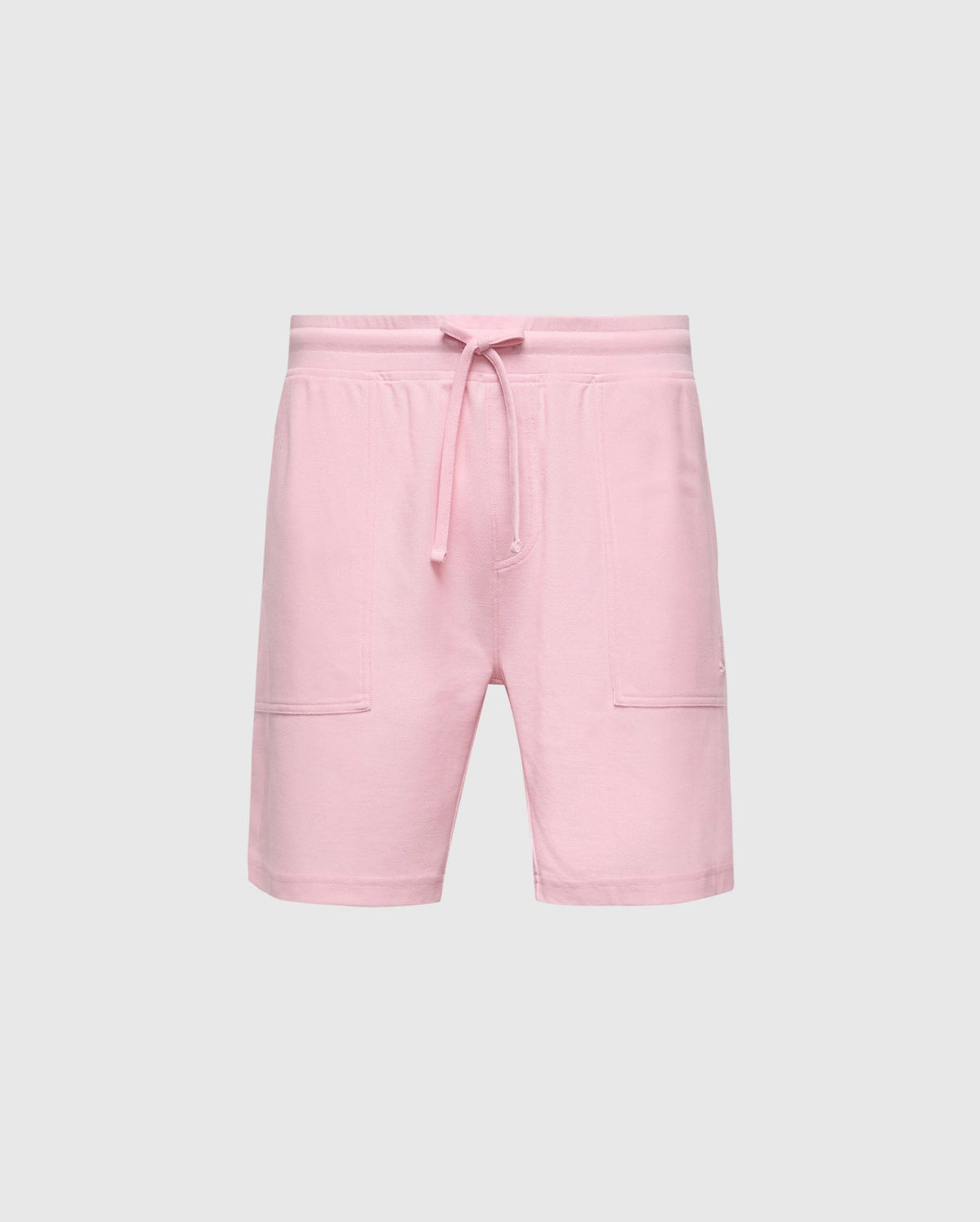 The MENS TAYLOR LIGHT PIQUE SWEATSHORT by Psycho Bunny, crafted from lightweight piqué, features an elastic waistband with a drawstring and two front pockets. Perfect for casual-chic wardrobes, they offer effortless style against a plain white background.