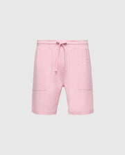The MENS TAYLOR LIGHT PIQUE SWEATSHORT by Psycho Bunny, crafted from lightweight piqué, features an elastic waistband with a drawstring and two front pockets. Perfect for casual-chic wardrobes, they offer effortless style against a plain white background.