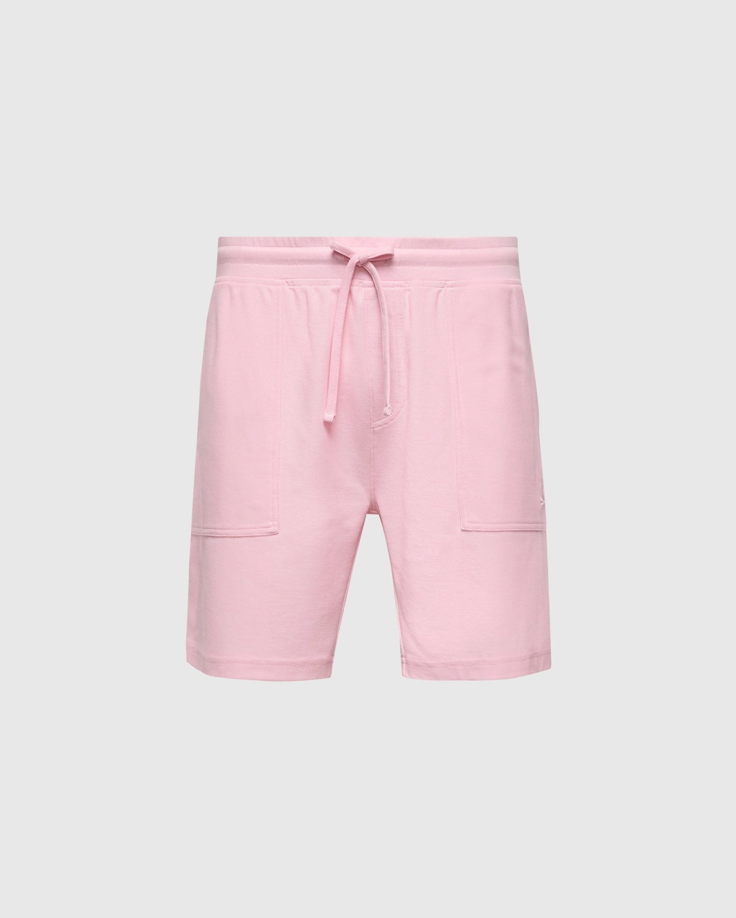 The MENS TAYLOR LIGHT PIQUE SWEATSHORT by Psycho Bunny, crafted from lightweight piqué, features an elastic waistband with a drawstring and two front pockets. Perfect for casual-chic wardrobes, they offer effortless style against a plain white background.