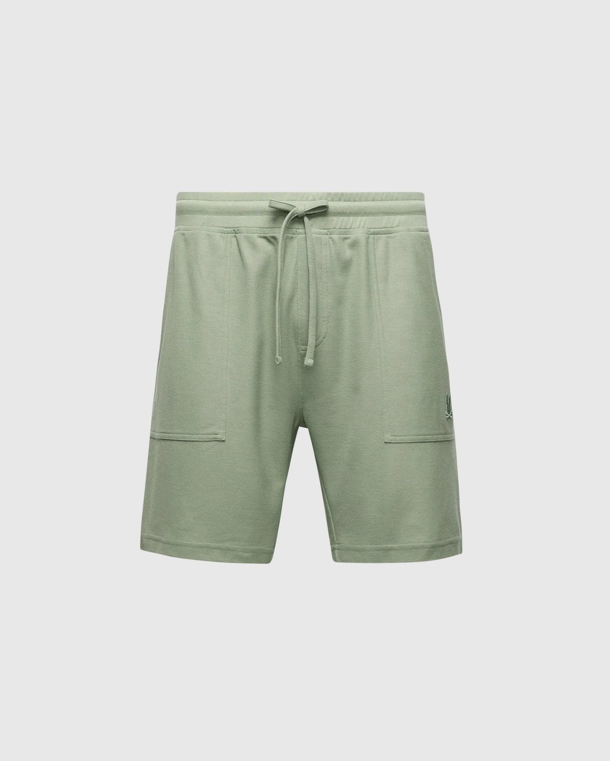 The Psycho Bunny MENS TAYLOR LIGHT PIQUE SWEATSHORT - B6R344F200 are green, relaxed-fit shorts made from lightweight Pima cotton piqué. Featuring an elastic waistband with a drawstring and two front pockets, they rest just above the knee for a soft, casual-chic comfortwear style.