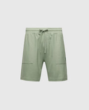 The Psycho Bunny MENS TAYLOR LIGHT PIQUE SWEATSHORT - B6R344F200 are green, relaxed-fit shorts made from lightweight Pima cotton piqué. Featuring an elastic waistband with a drawstring and two front pockets, they rest just above the knee for a soft, casual-chic comfortwear style.