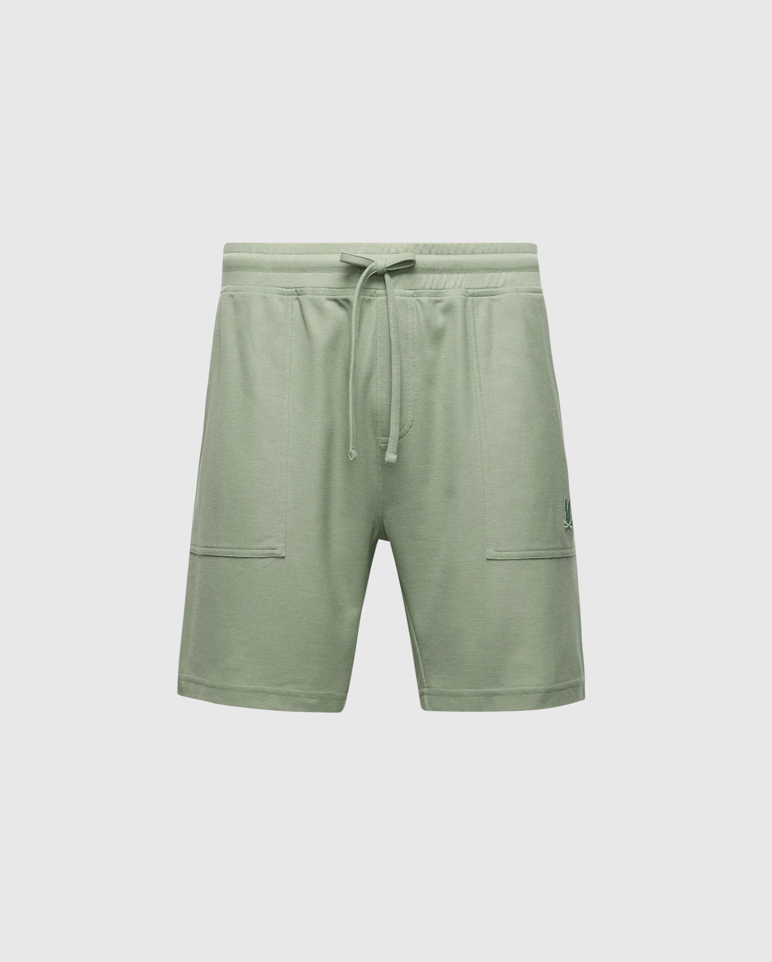The Psycho Bunny MENS TAYLOR LIGHT PIQUE SWEATSHORT - B6R344F200 are green, relaxed-fit shorts made from lightweight Pima cotton piqué. Featuring an elastic waistband with a drawstring and two front pockets, they rest just above the knee for a soft, casual-chic comfortwear style.