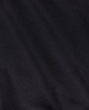 Close-up detail of a textured black fabric, suitable for Psycho Bunny's MENS YORK CHINO SHORT - B6R357B200, showing subtle variations in shading and the intricacies of the weave pattern.