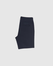 Image of a folded pair of navy blue sweat shorts from the Psycho Bunny collection. The MENS OUTLINE SWEATSHORTS - B6R507ARCN feature a back pocket with a rectangular label above it, displaying some text. The background is plain white.