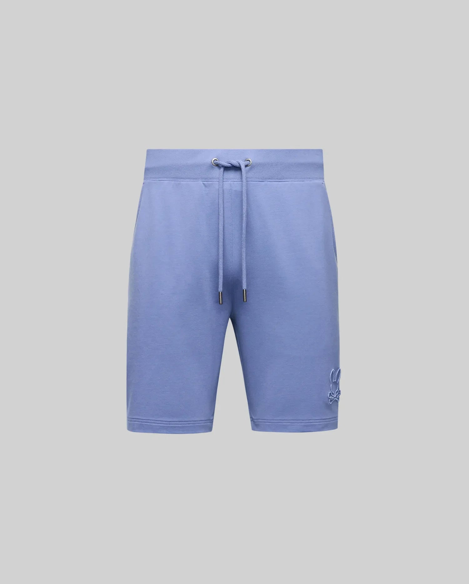 The Psycho Bunny Men's Levanzo French Terry Sweatshort (B6R578F200) in light blue features soft micro French terry, side pockets, and a small embroidered bunny logo on the lower left leg, shown against a plain gray background.