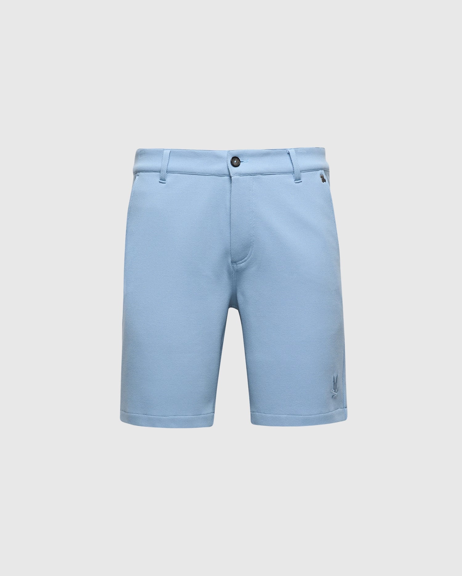 The MENS SHIRO KNIT HONEYCOMB SHORT - B6R585F200 from Psycho Bunny are light blue tailored shorts with belt loops, a front button closure, side pockets, and an embroidered bunny near the hem. Photographed against a plain white background, they're ideal for any occasion.