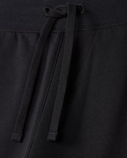 A close-up view of the MENS LEVY FLEECE SWEATSHORT - B6R862D200 by Psycho Bunny reveals a ribbed waistband with an adjustable drawstring. The fabric looks soft and comfortable, making these sweatshorts an everyday staple suitable for casual wear or exercise.