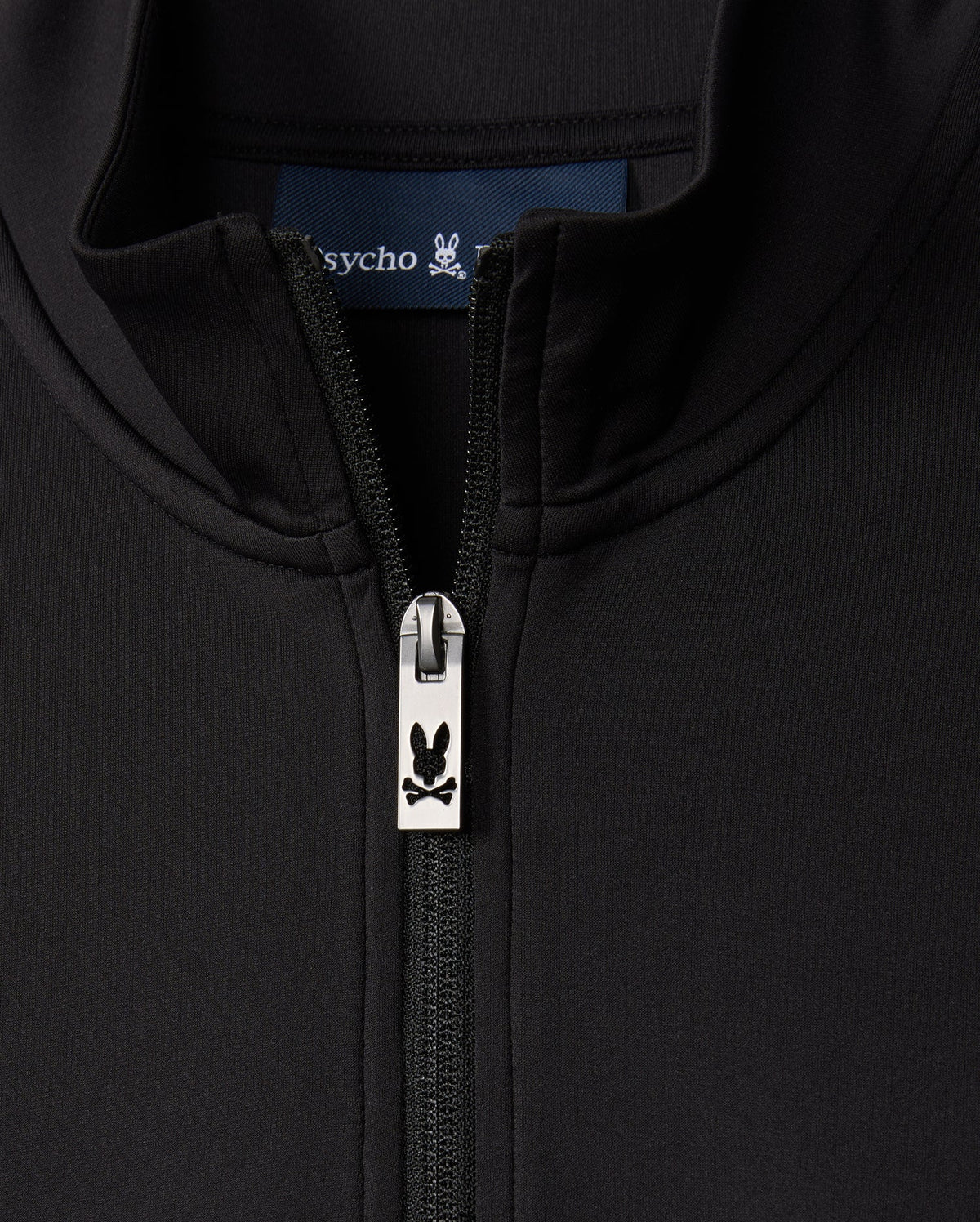 This MENS LAURIER 1/4 ZIP HOODIE - B6S149D200 in black from Psycho Bunny features a front zipper adorned with a bunny skull logo on the pull. Embodying an athleisure vibe, the hoodie’s collar and inner label subtly echo the word "psycho," evoking a bold cotton jersey style.