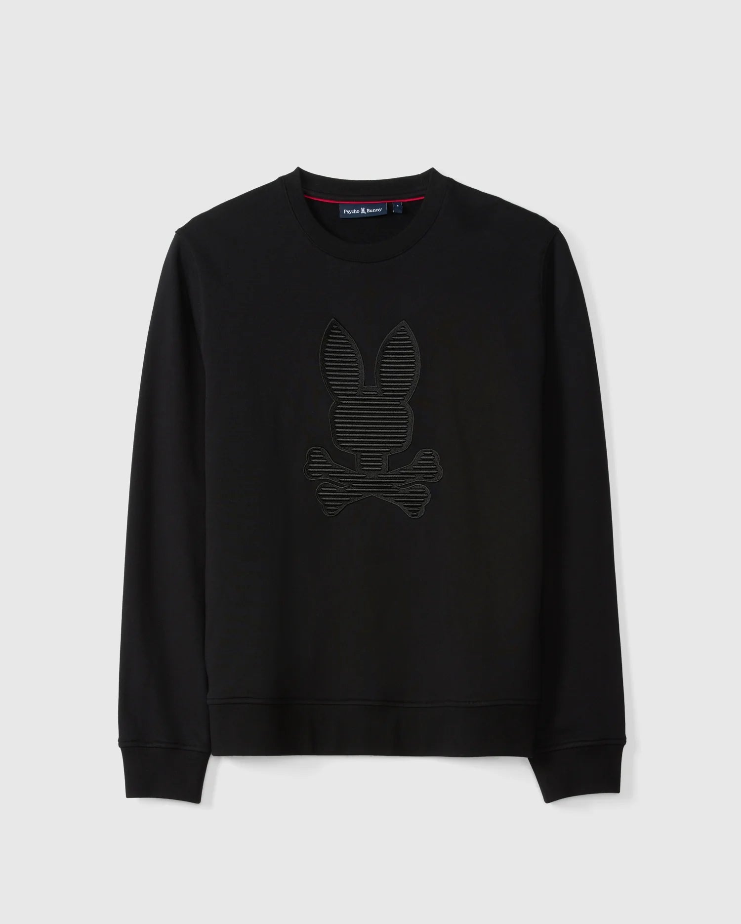 The Psycho Bunny Men's Kingston Sweatshirt (B6S480D200) is crafted from lush cotton jersey in black and showcases a striking 3D-embroidered rabbit head with crossed bones on the front. Complete with long sleeves and a crew neckline, the design stands out against its plain background.