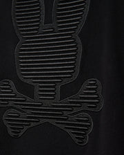 Close-up of the MENS KINGSTON SWEATSHIRT - B6S480D200 by Psycho Bunny, showcasing a lush cotton jersey fabric with an embossed pattern that resembles a cartoonish skull and crossbones adorned with bunny ears. This design, evocative of the Kingston 3D-embroidery sweatshirt styles, is crafted with textured, raised lines.
