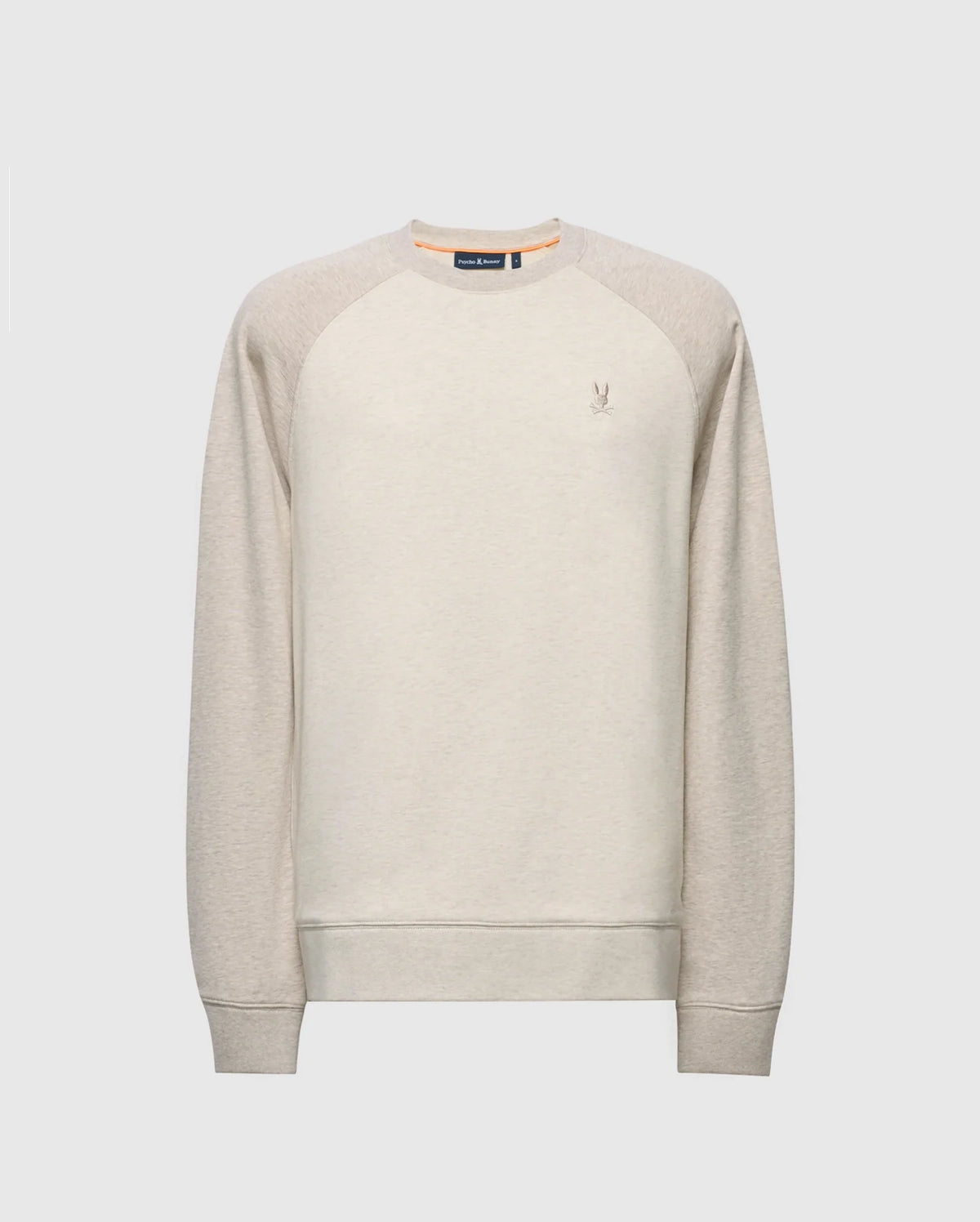 The Psycho Bunny MENS ARCHIE MELANGE COLOR BLOCK SWEATSHIRT - B6S630F200 is a light beige crewneck with raglan sleeves and an embroidered Bunny logo on the chest, featuring a ribbed collar, cuffs, and hem. Ideal for monochrome styling.