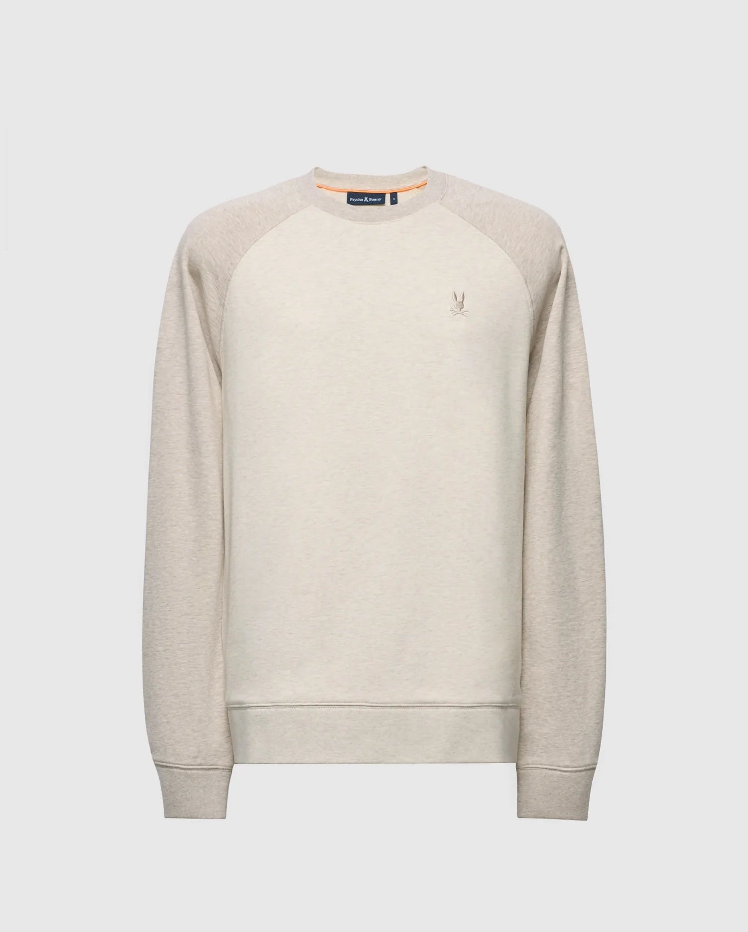 The Psycho Bunny MENS ARCHIE MELANGE COLOR BLOCK SWEATSHIRT - B6S630F200 is a light beige crewneck with raglan sleeves and an embroidered Bunny logo on the chest, featuring a ribbed collar, cuffs, and hem. Ideal for monochrome styling.