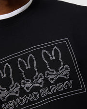 Close-up of the MENS TACOMA MODAL SWEATSHIRT from Psycho Bunny, showcasing a black garment adorned with a design of three stylized bunny heads and crossbones, outlined in white. Made from premium modal fabric, the words "Psycho Bunny" are featured below the design for a touch of luxurious comfort and style.