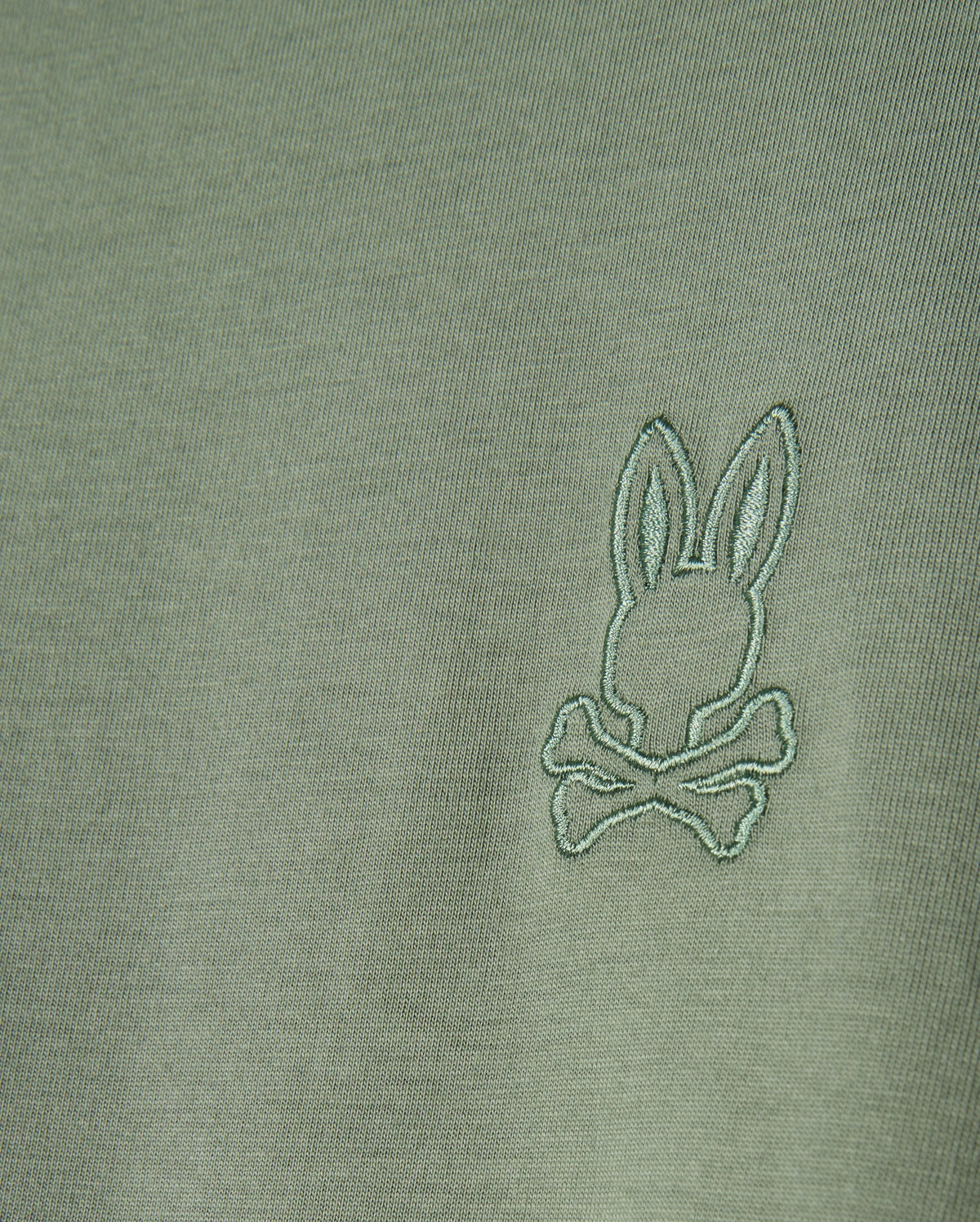 The MENS ALBERTON LONG SLEEVE TEE - B6T867D200 by Psycho Bunny is a fashion masterpiece, crafted from olive green Pima cotton and featuring an embroidered logo with a stylized rabbit head above crossed bones.