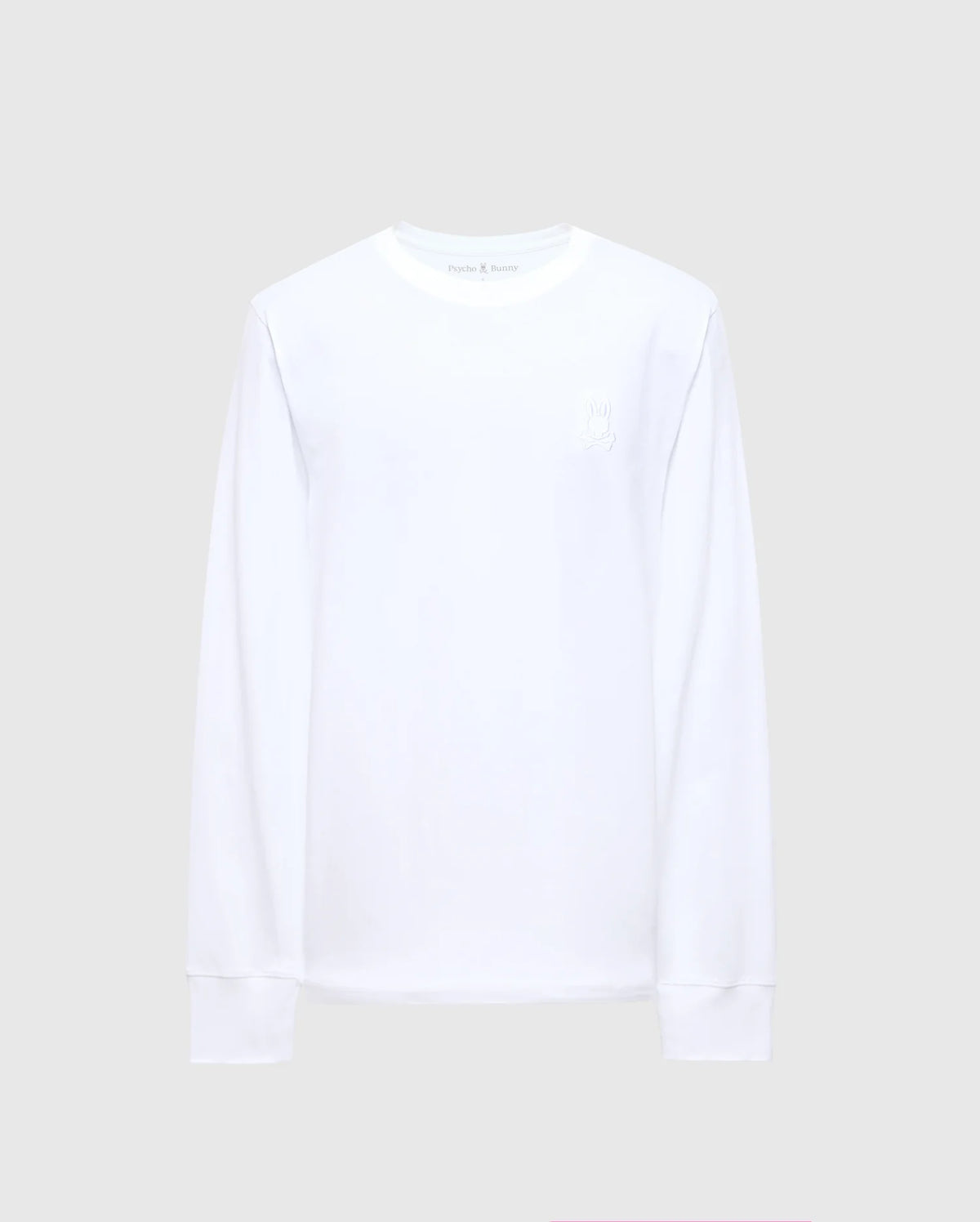 The Psycho Bunny MENS ALBERTON LONG SLEEVE TEE - B6T867E200 is showcased against a light gray background. This Pima Cotton casual men's top comes in plain white and boasts a round neckline with subtle stitching details on the collar and cuffs, providing both comfort and style for any occasion.