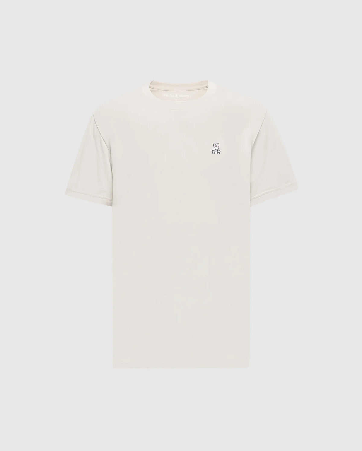 The Psycho Bunny Men's Classic Crew Neck Tee (B6U014B200) in light beige is a premium Pima cotton shirt with short sleeves and an embroidered bunny logo on the upper left chest. Set against a simple white background, it embodies timeless appeal.