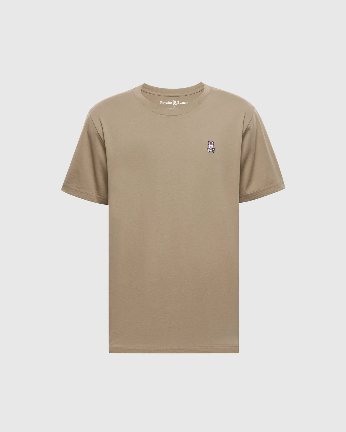 The Psycho Bunny Men's Classic Crew Neck Tee (B6U014CRPC) is a wardrobe essential made from 100% Pima cotton in beige, featuring a purple and white embroidered bunny logo on the left chest and a matching beige rib-knit trim for style.