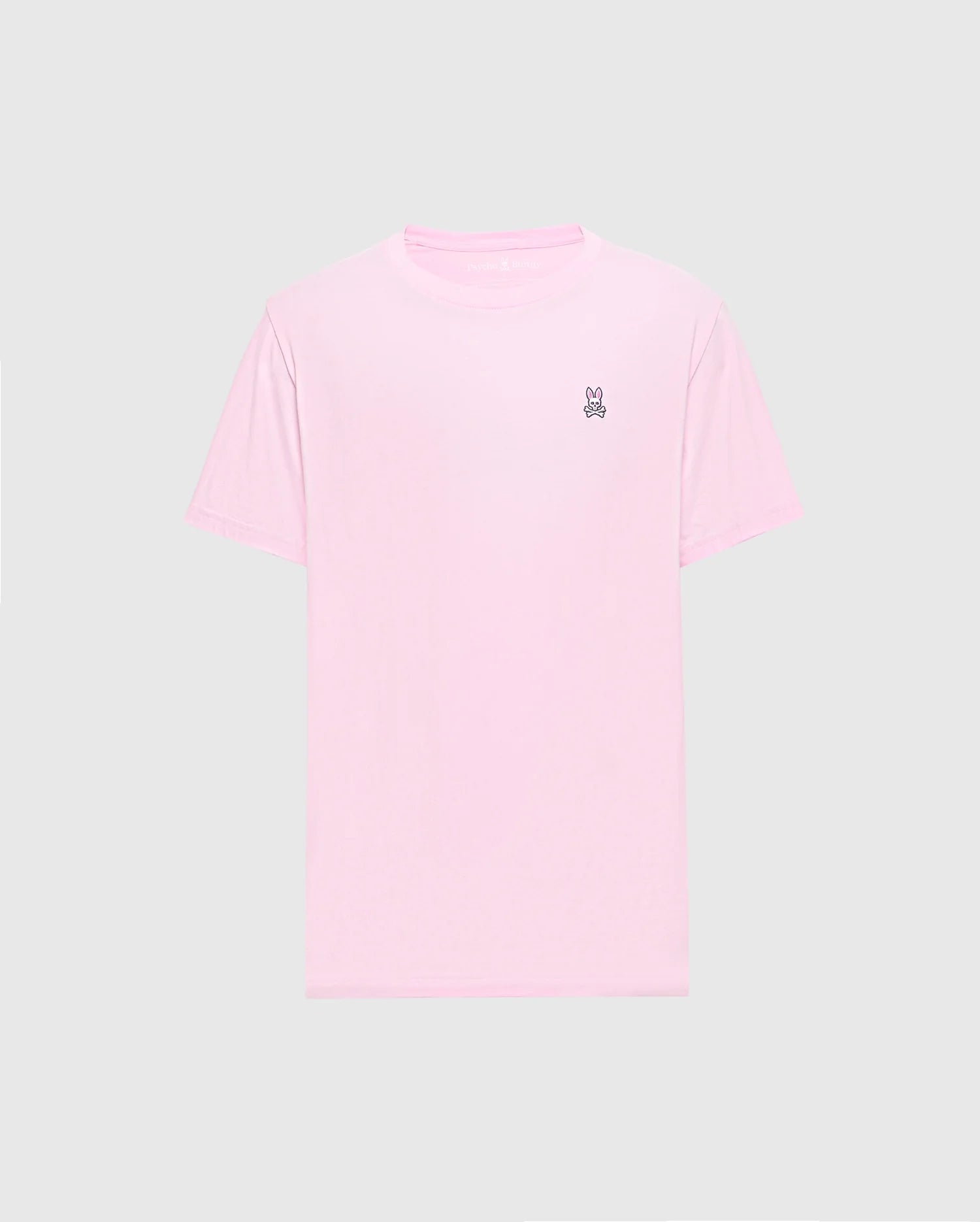 The light pink Men's Classic Crew Neck Tee (B6U014CRPC) by Psycho Bunny is crafted from soft pima cotton with a small embroidered peace sign hand symbol on the top left chest against a plain gray background, making it versatile and stylish for any casual occasion.