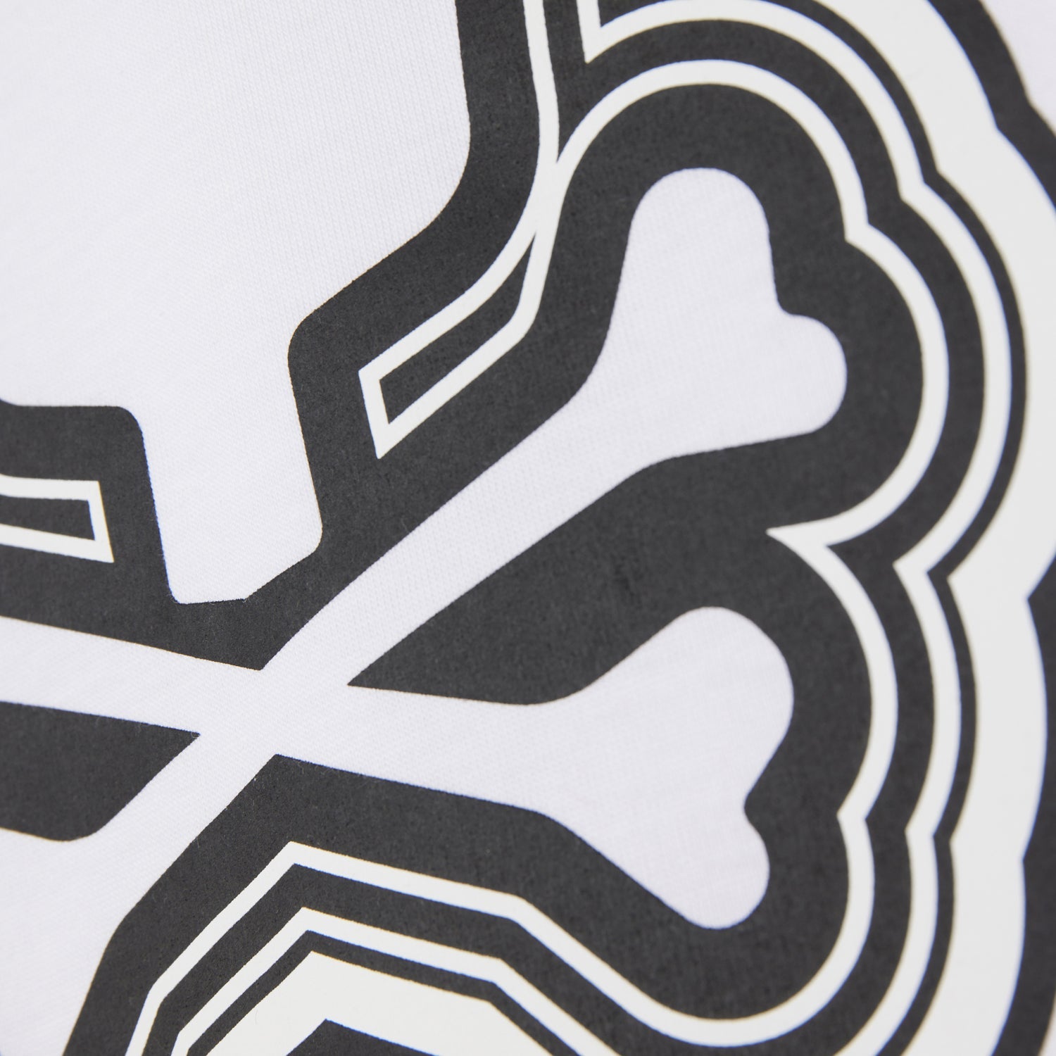 Close-up of a MENS MAYBROOK GRAPHIC TEE featuring bold black and white lines with abstract, curvilinear shapes on a Pima cotton background by Psycho Bunny.