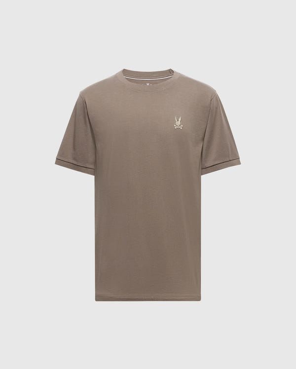 The MENS ALEXANDER FASHION TEE - B6U139E200 by Psycho Bunny is an exquisite men's Pima cotton T-shirt in plain brown. It showcases a small embroidered bird logo on the upper left chest area. Set against a light backdrop, this tee represents premium quality men's fashion with its elegant simplicity.