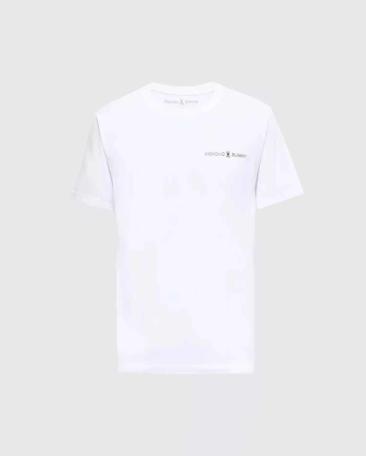 The MENS LONGMONT GRAPHIC TEE - B6U194E200 from Psycho Bunny showcases the iconic logo and name on the chest, beautifully highlighted against a plain gray backdrop. Made with premium Pima Cotton, this white T-shirt provides exceptional comfort, making it perfect for any casual men's wardrobe.