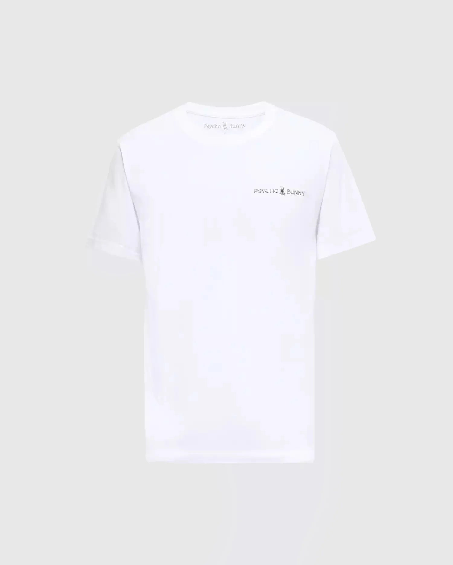 The MENS LONGMONT GRAPHIC TEE - B6U194E200 from Psycho Bunny showcases the iconic logo and name on the chest, beautifully highlighted against a plain gray backdrop. Made with premium Pima Cotton, this white T-shirt provides exceptional comfort, making it perfect for any casual men's wardrobe.