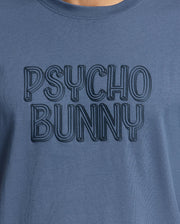 Close-up of the men's Monarc Wordmark Graphic Tee by Psycho Bunny, crafted in premium Pima cotton, featuring embossed text that reads "PSYCHO BUNNY," offering unparalleled comfort.